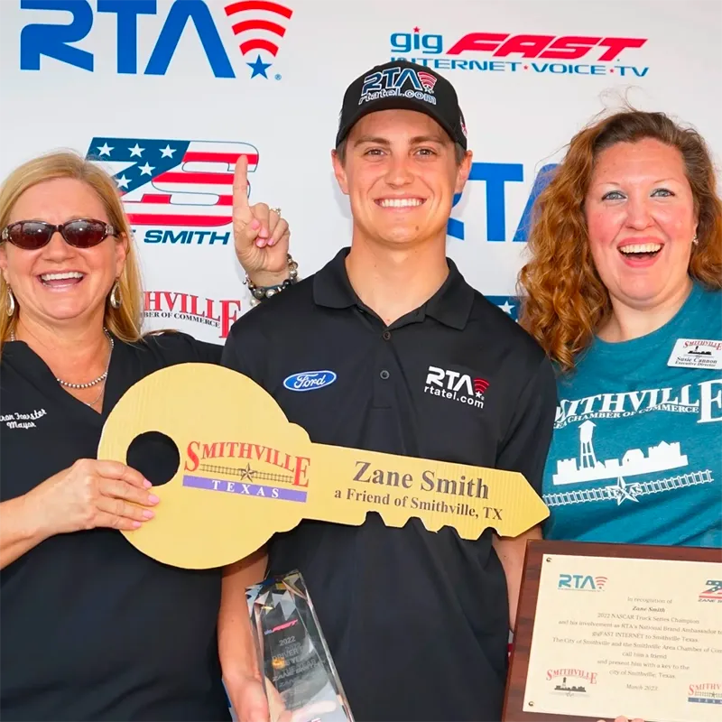 Sharon Foerster, Mayor of the City of Smithville and the Smithville Area Chamber of Commerce featuring Zane Smith, the 2022 NASCAR CRAFTSMAN Truck Series Champion and last years COTA winner, with the “Key to the City.”
